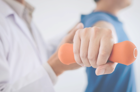 Image of hand lifting a small weight