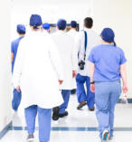 Photo of a group of doctors walking away